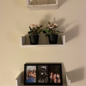 3 white wooden shelves